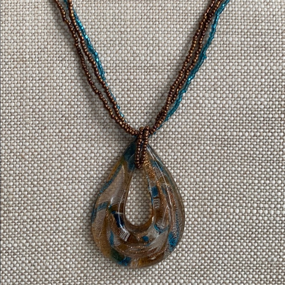 Glass pendant with multi strand beaded necklace